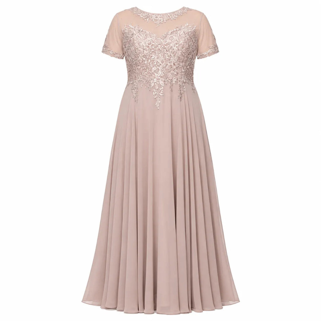 A floor-length A-line evening gown in a dusty blush pink color, featuring a sheer short-sleeve neckline with silver floral lace embroidery across the bodice.