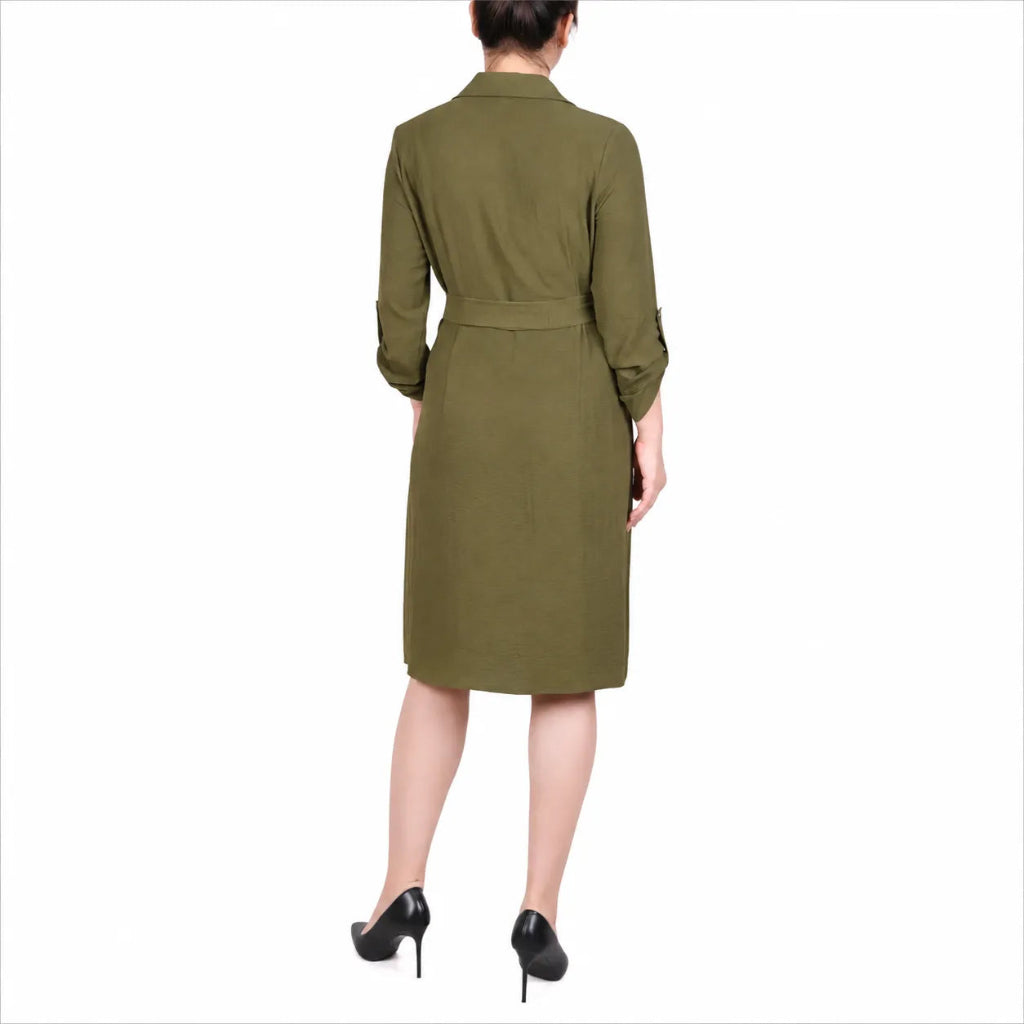 A woman shown from the back wearing an olive green knee-length dress with three-quarter sleeves and a matching waist belt, paired with black high heels against a plain white background.