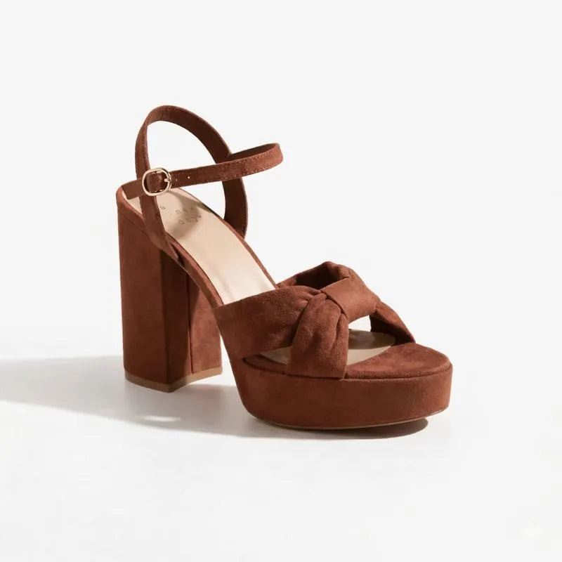 Brown suede platform sandal on a white background