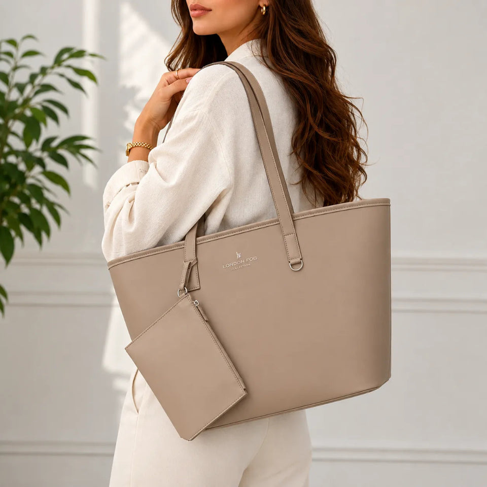A woman wearing a cream-colored outfit carries a taupe beige tote bag with a matching zippered pouch. The brand name 'LOVE & LEO' is subtly printed on the front of the tote bag.