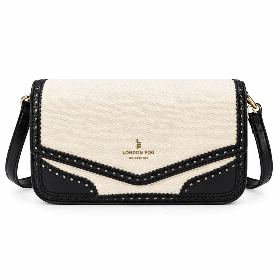A London Fog Collection crossbody bag featuring a cream canvas body with black leather trim, decorative scalloped edges, and gold-tone hardware.