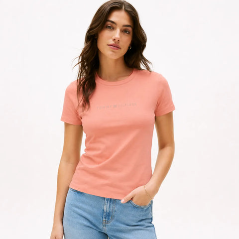 Woman wearing a pink t-shirt with text on a white background