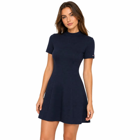 Woman wearing a navy blue dress on a white background