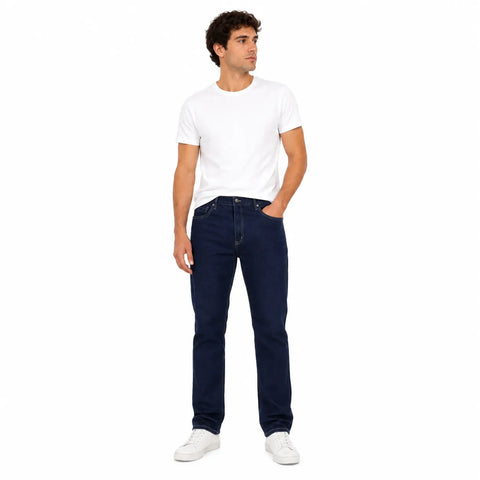 Man wearing a white t-shirt and dark blue jeans on a white background