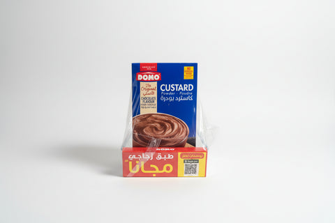 DOMO custard powder packaging on a wooden surface