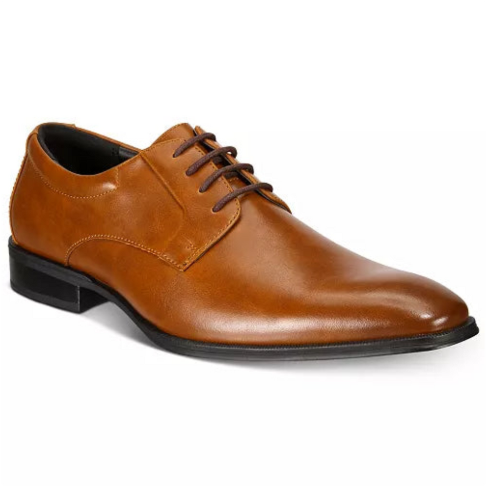 Brown leather dress shoe on a white background