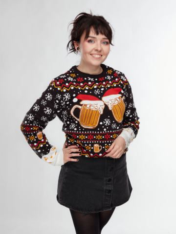 Person wearing a festive sweater with beer mug designs on a white background