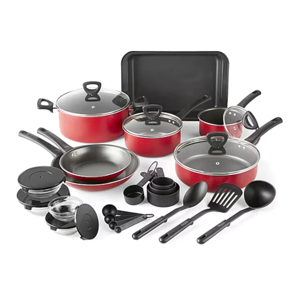 A 24-piece cookware set with red exterior and black interior cookware, including multiple pots, pans, lids, measuring cups, spoons, and a baking pan, arranged on a white background.