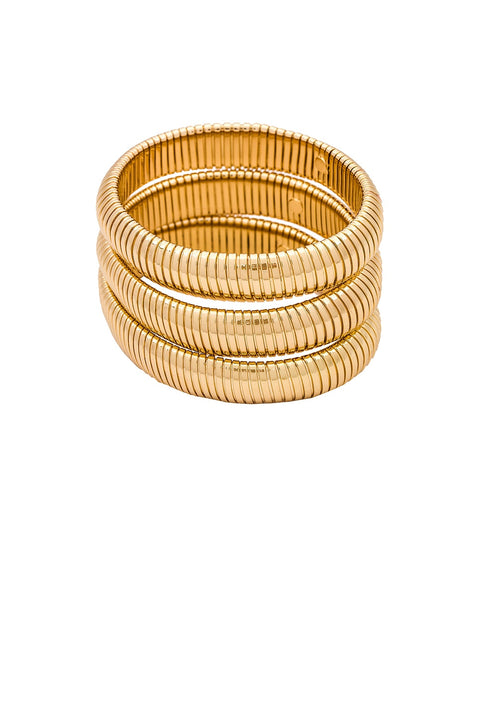 Set of gold bangles on a white background