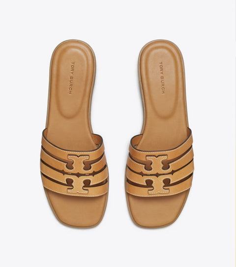 Tan sandals with a brand logo on a white background