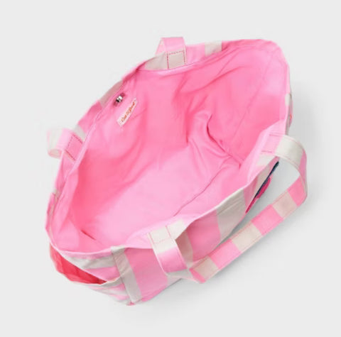Pink backpack with white straps on a light gray background
