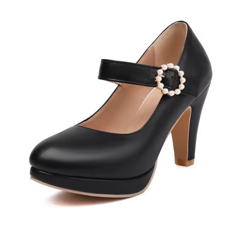 Black high-heeled shoe with a pearl buckle on a white background