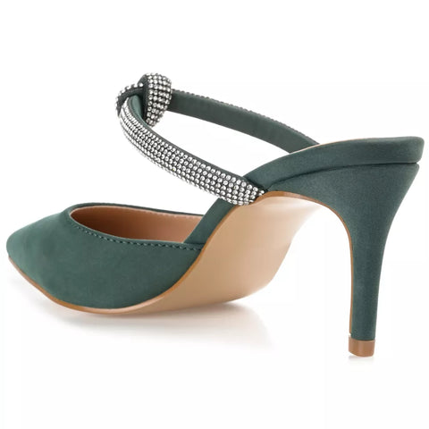 Green high-heeled shoe with embellished strap on a white background