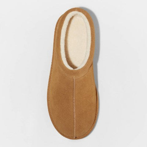 Tan slipper with white interior on a light gray background