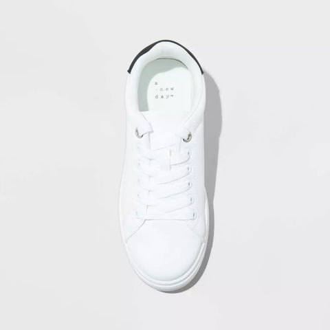 White sneaker with black accents on a light gray background