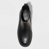 Black Chelsea boot on a light gray background