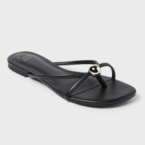 Black sandal with a decorative strap on a white background