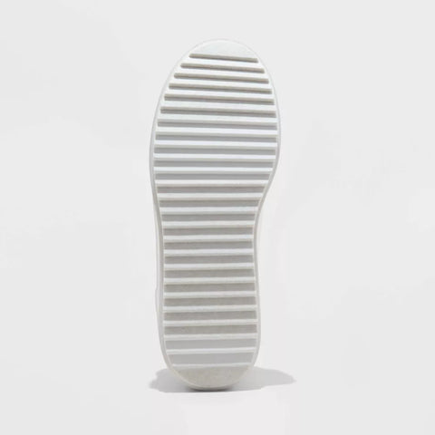 White sole of a shoe on a light gray background