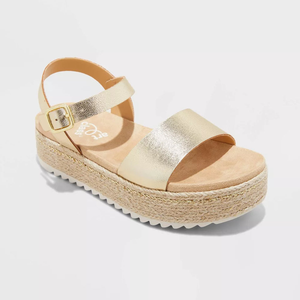 Gold platform sandal on a light gray background