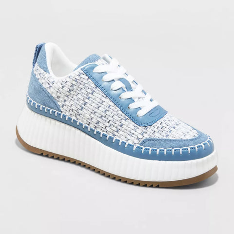 White and blue sneaker on a light gray background