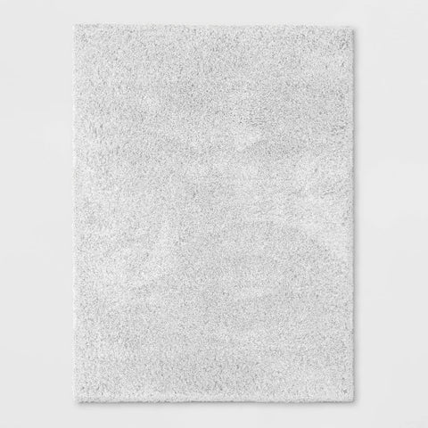 Textured gray rug on a light gray background