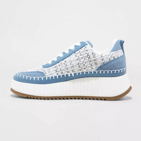 Blue and white sneaker with a textured pattern on a light gray background