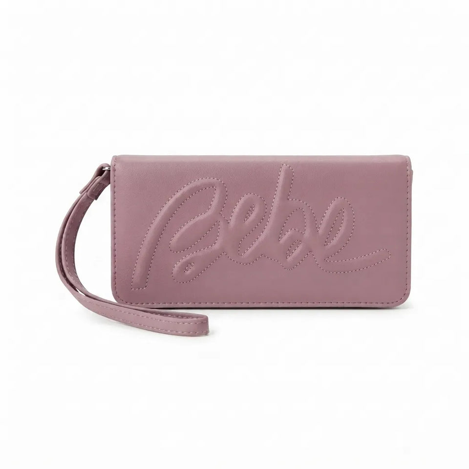 A dusty pink faux leather wristlet clutch with an embossed cursive logo on the front, featuring a matching wrist strap, shown against a plain white background.