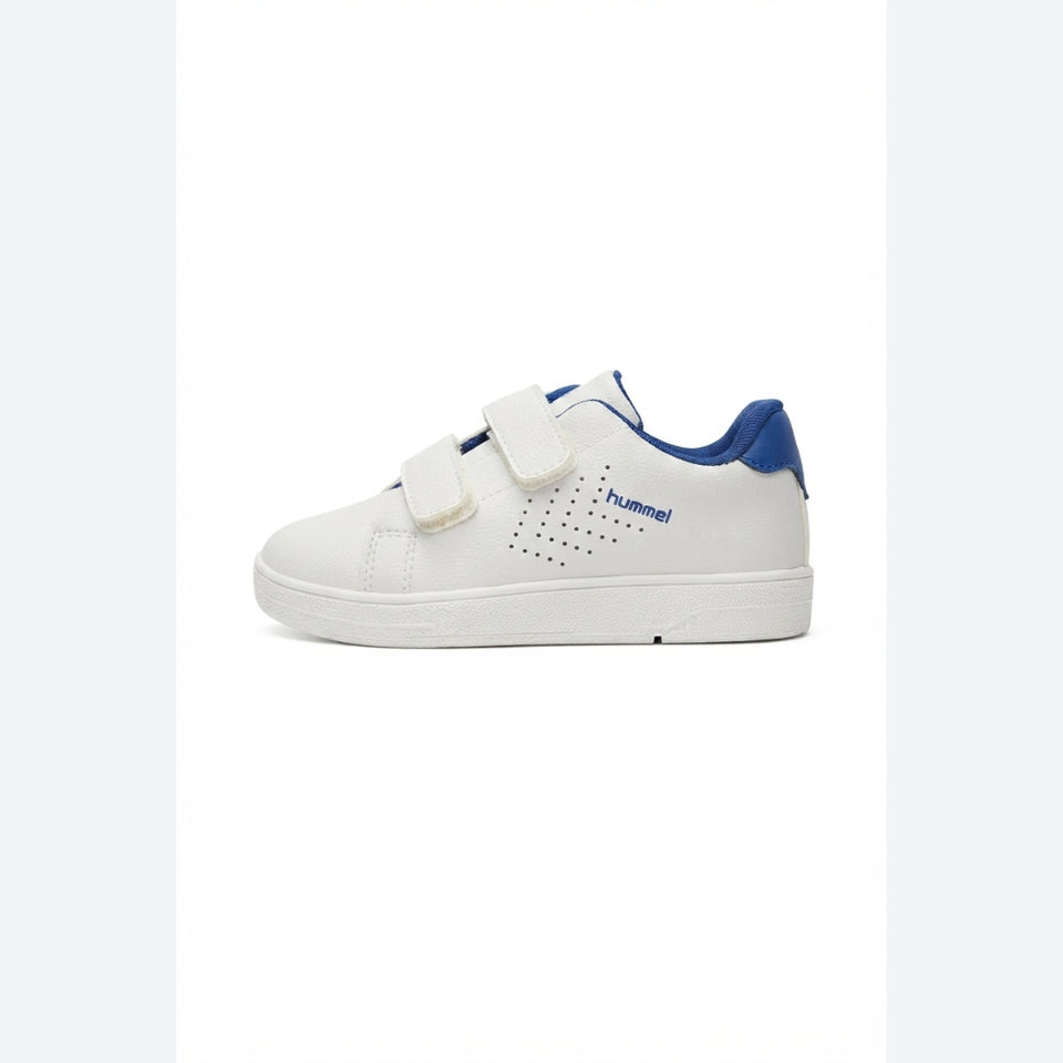 A white children's low-top sneaker with blue accents, featuring two hook-and-loop straps and the 'Hummel' brand name printed in blue on the side, set against a plain white background.