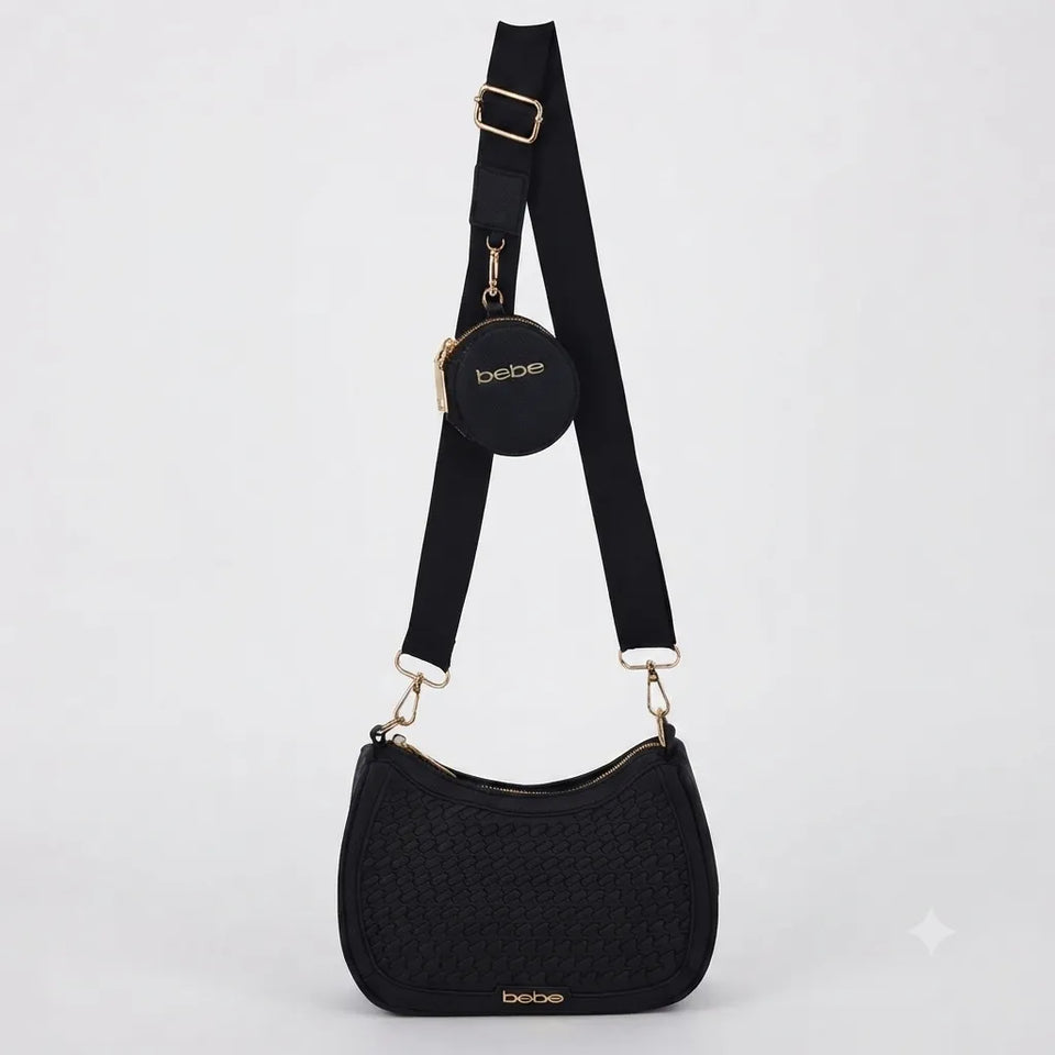 Black woven crescent shoulder bag with an adjustable black strap, a small round black coin pouch, and gold-tone hardware, shown on a light gray background.
