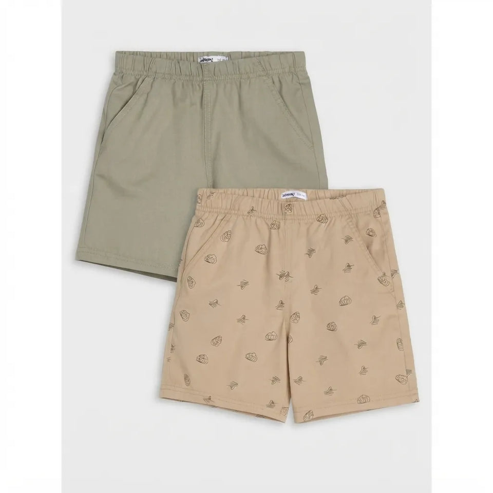 Two pairs of kids' shorts displayed flat against a light gray background. The top pair is a solid olive green, and the bottom pair is a light beige with a small brown leaf pattern.