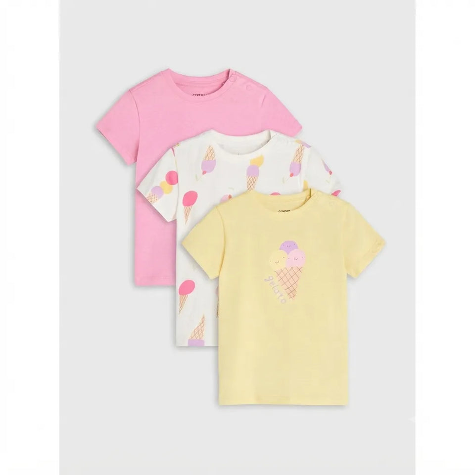 Three children's short-sleeve T-shirts arranged in a stack on a light gray background: one pink shirt, one white shirt with pastel ice cream cone prints, and one pale yellow shirt with a large ice cream cone graphic on the chest.