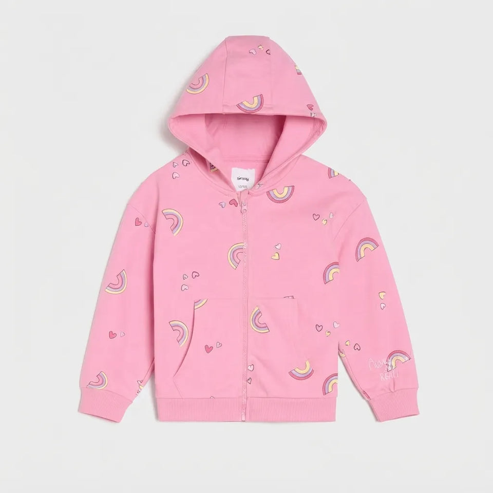 A pink zip-up hoodie with an all-over rainbow and heart print, displayed flat against a light gray background.