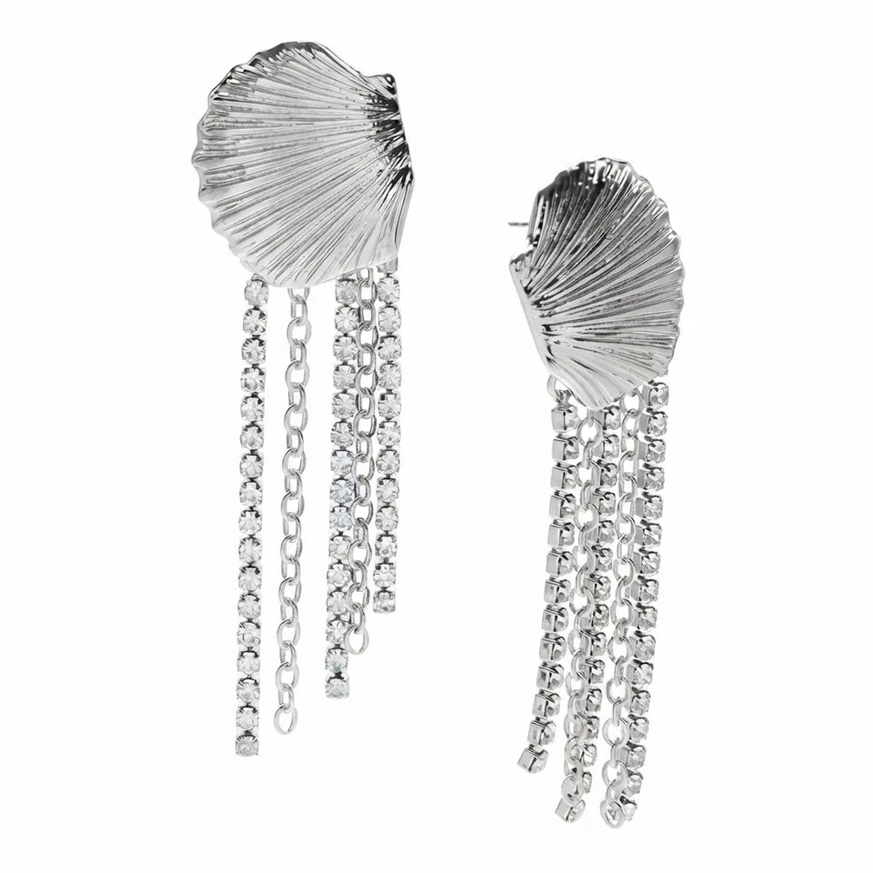 A pair of silver shell-shaped dangle earrings with textured, fan-like tops and multiple dangling chain strands, shown on a plain white background.