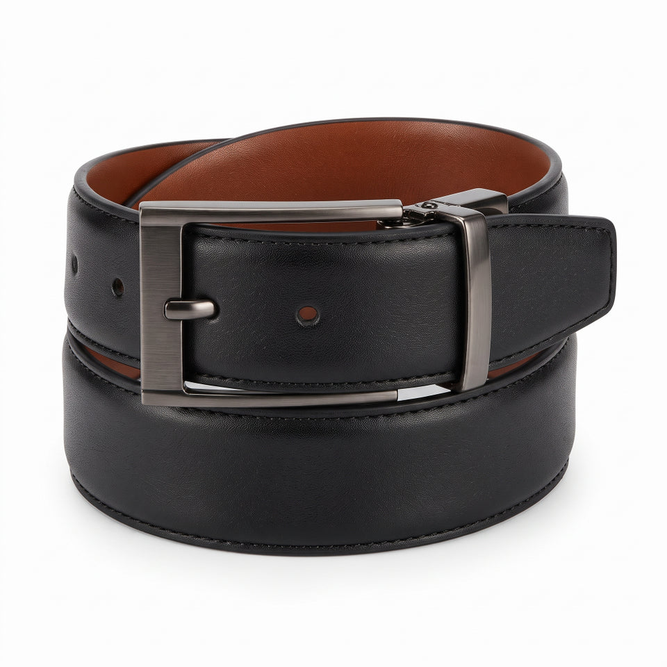 A black leather belt with a brushed silver metal buckle, coiled on a white background to show both the black exterior and the brown interior.
