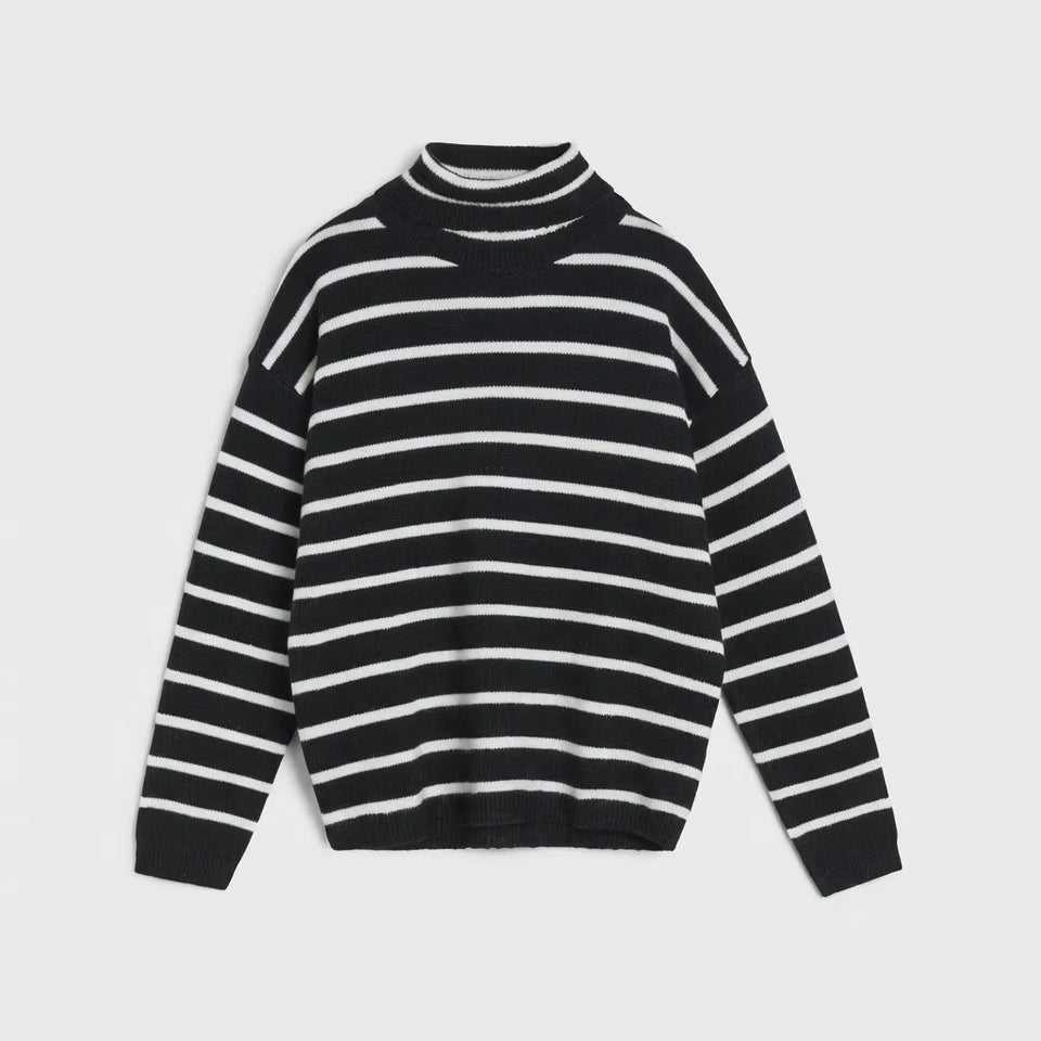 A black and white horizontally striped knit mock neck sweater with long sleeves, displayed flat against a light gray background.