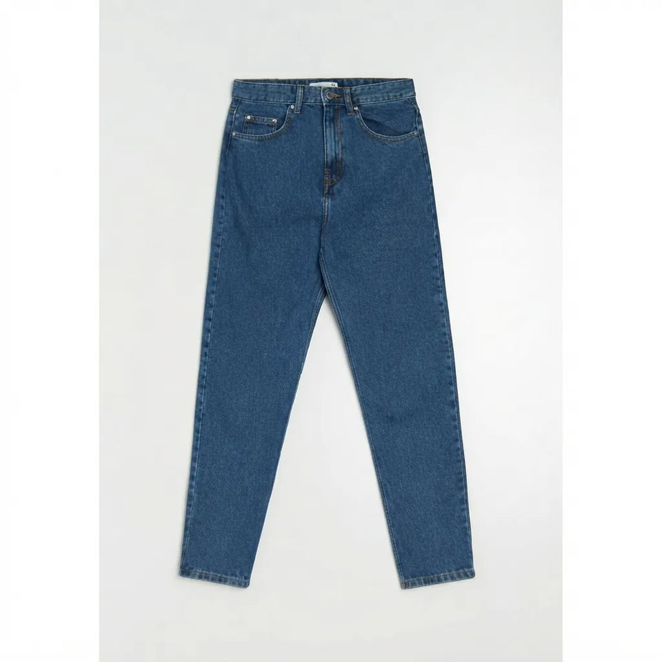 A pair of medium wash blue denim jeans laid flat against a light gray background.