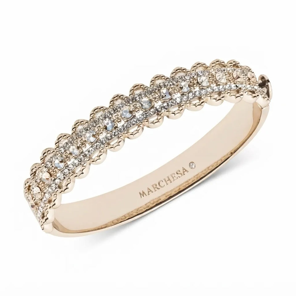 A rose gold eternity ring featuring a double row of pavé-set clear diamonds, with the brand name 'MARCHESA' engraved on the inner band, set against a clean white background.