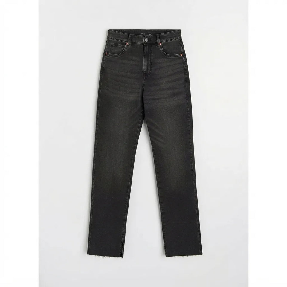 A pair of dark gray washed denim jeans with a straight-to-regular leg fit and raw frayed hems, displayed flat against a light gray background.