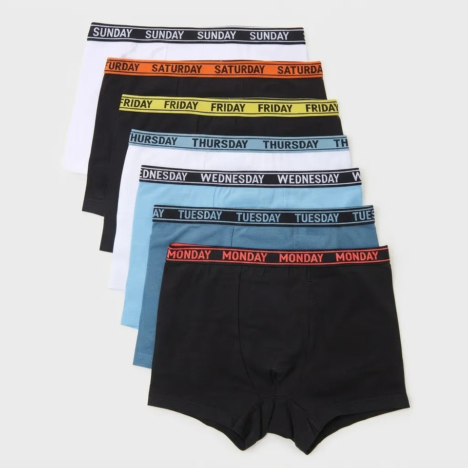 A 5-pack of men's boxer briefs fanned out on a light gray background, featuring black, white, orange, yellow, and blue colors with corresponding weekday elastic bands labeled SUNDAY through MONDAY.