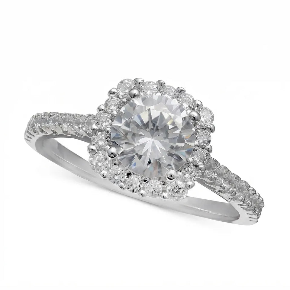 A silver-colored halo engagement ring featuring a round brilliant-cut center stone surrounded by a double halo of smaller round stones, with a pavé-set band, shown on a plain white background.