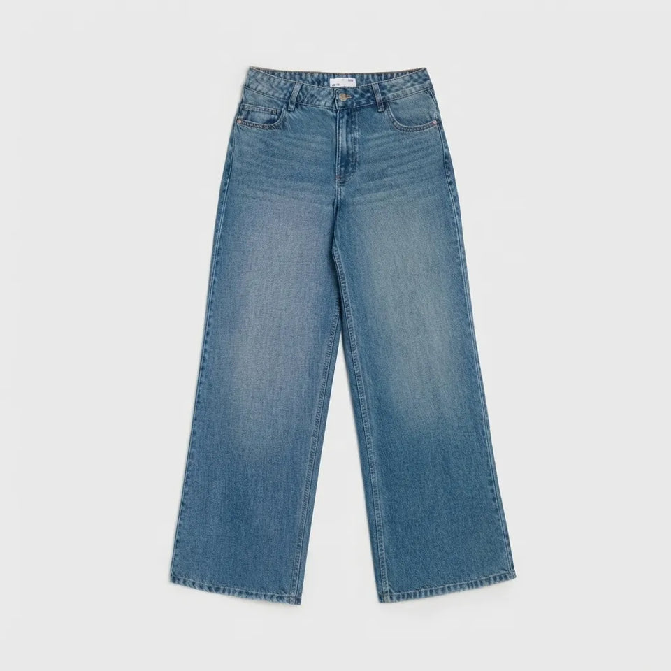 A pair of high-waisted, wide-leg blue denim jeans shown flat against a light gray background.