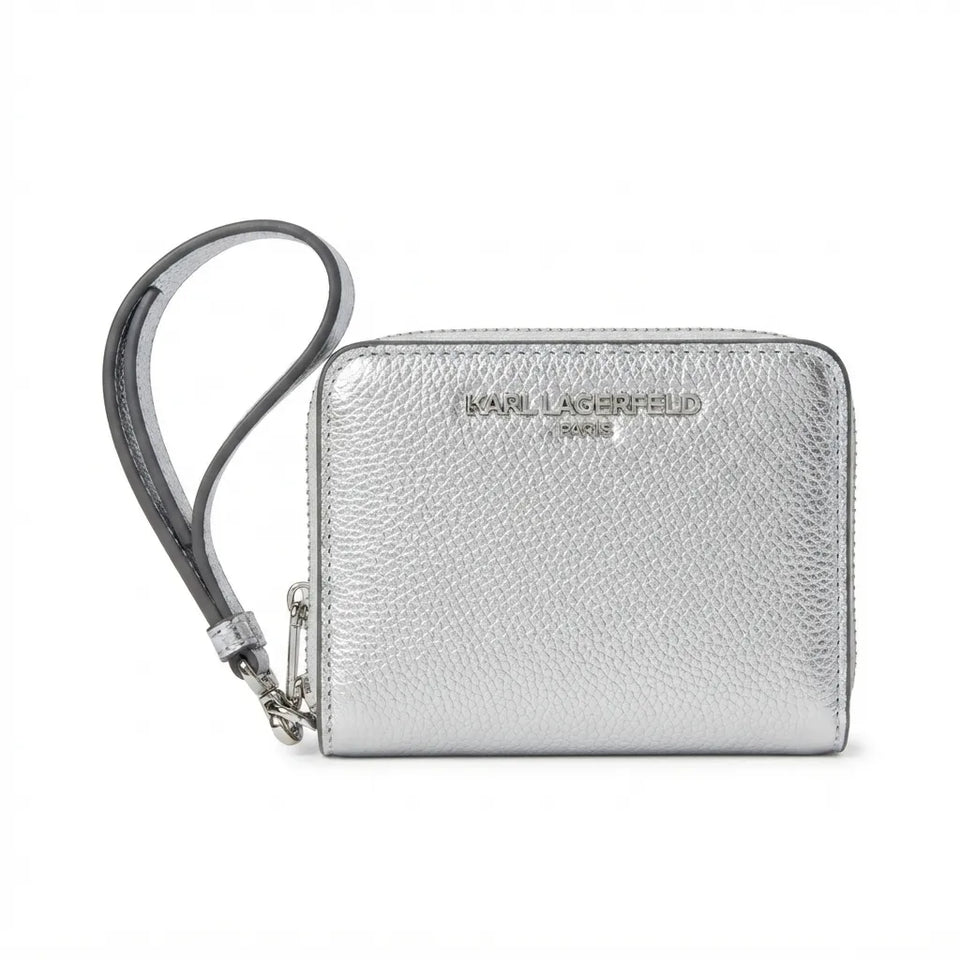 A silver pebbled leather wristlet wallet by Karl Lagerfeld Paris, featuring a matching silver wrist strap and silver-tone hardware, shown on a plain white background.