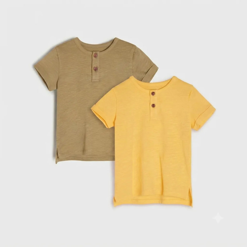 Two short-sleeve Henley shirts for kids, one in a warm khaki-beige color and the other in a bright mustard yellow, both featuring a three-button placket, displayed on a light gray background.