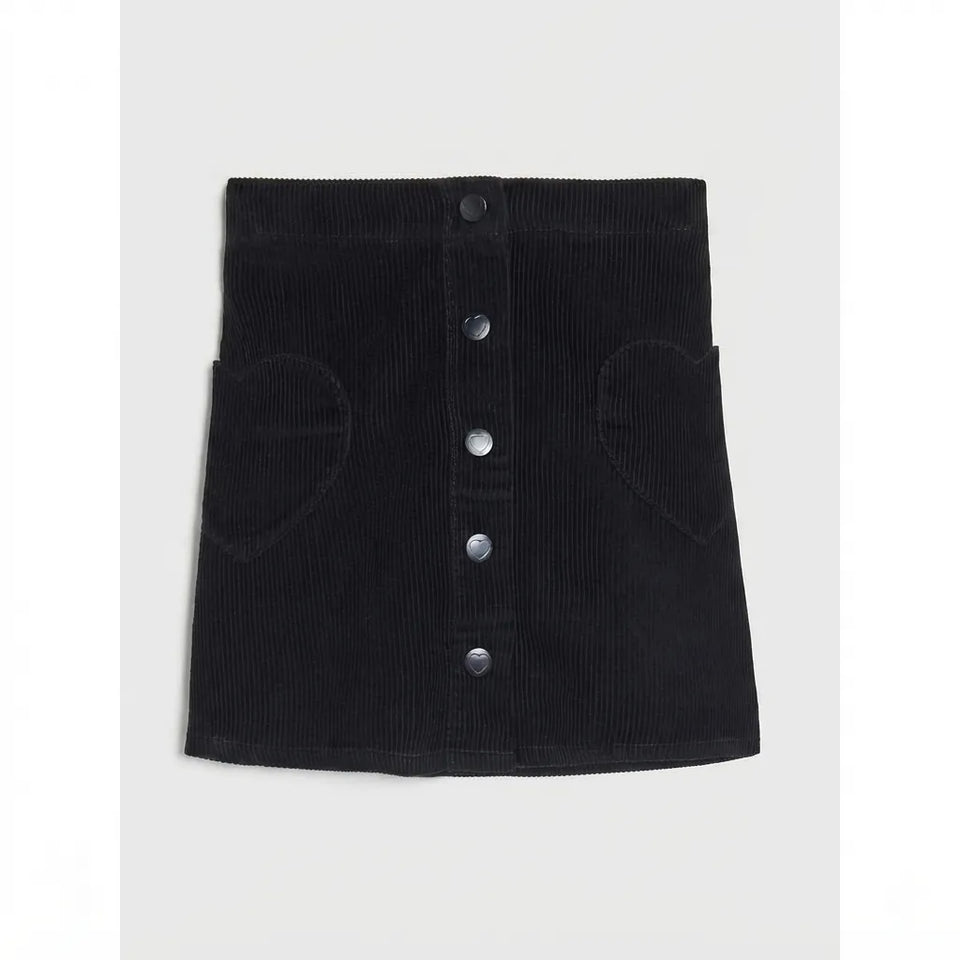 A black corduroy mini skirt with a button-up front and heart-shaped patch pockets on the sides, shown flat against a light gray background.