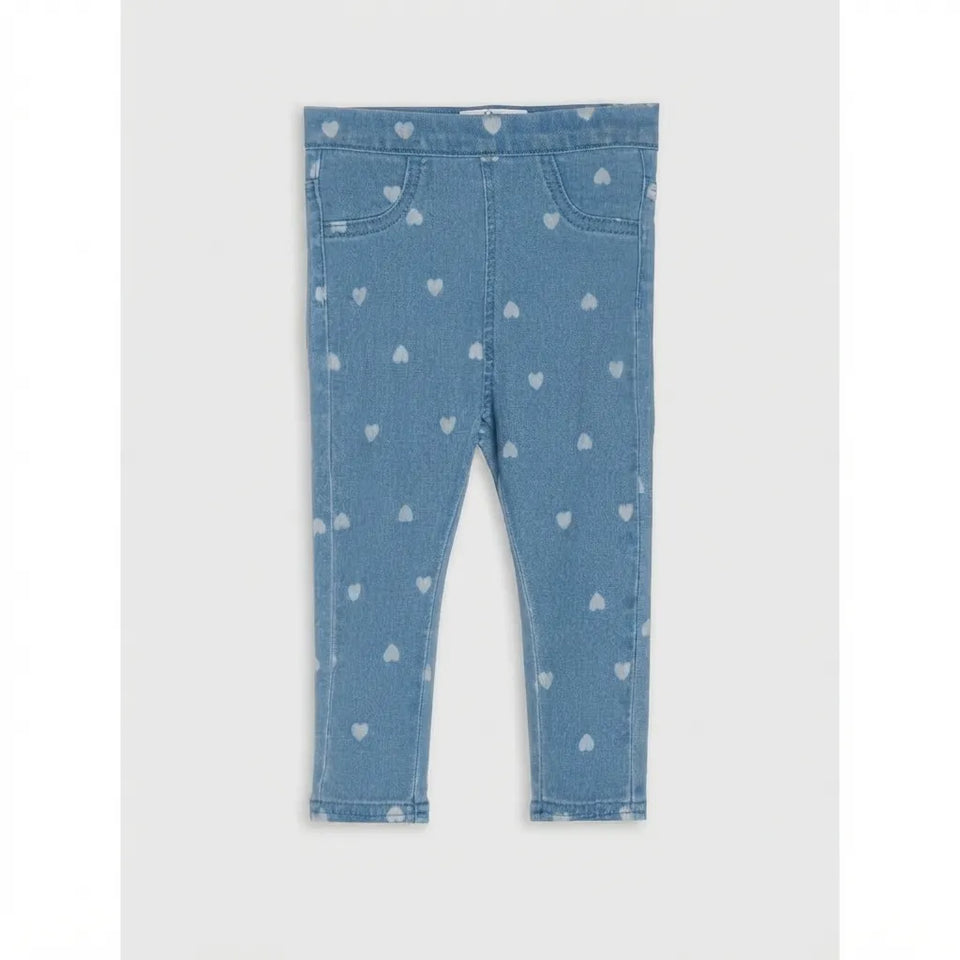 Light blue denim leggings for toddlers, featuring an all-over pattern of small white hearts and classic five-pocket styling.