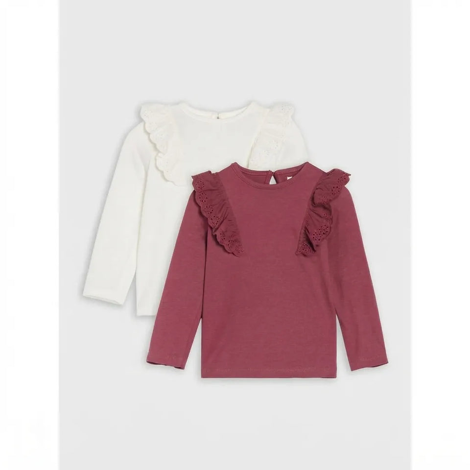 Two long-sleeve children's tops with ruffled shoulder details, shown overlapping on a light gray background. The front top is dusty rose, and the back top is off-white.