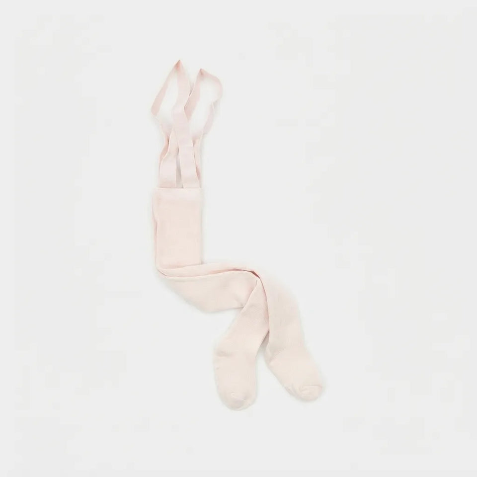 A pair of pale blush pink tights folded neatly on a clean, solid white background.