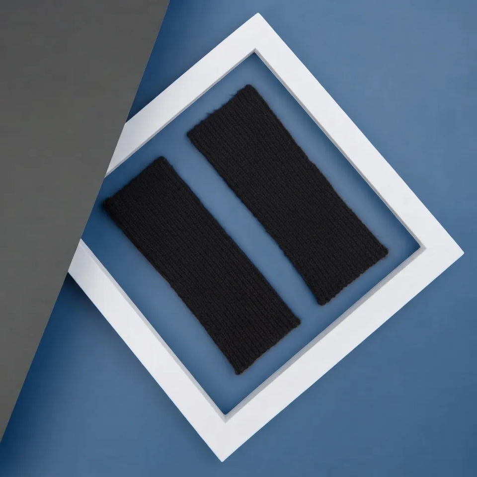 Two black knit wristbands displayed inside a white diamond-shaped frame on a blue background.