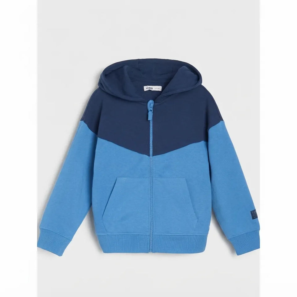 A colorblock zip-up hoodie for kids, featuring a navy blue upper section and hood, and a bright blue lower body and sleeves, shown against a light gray background.