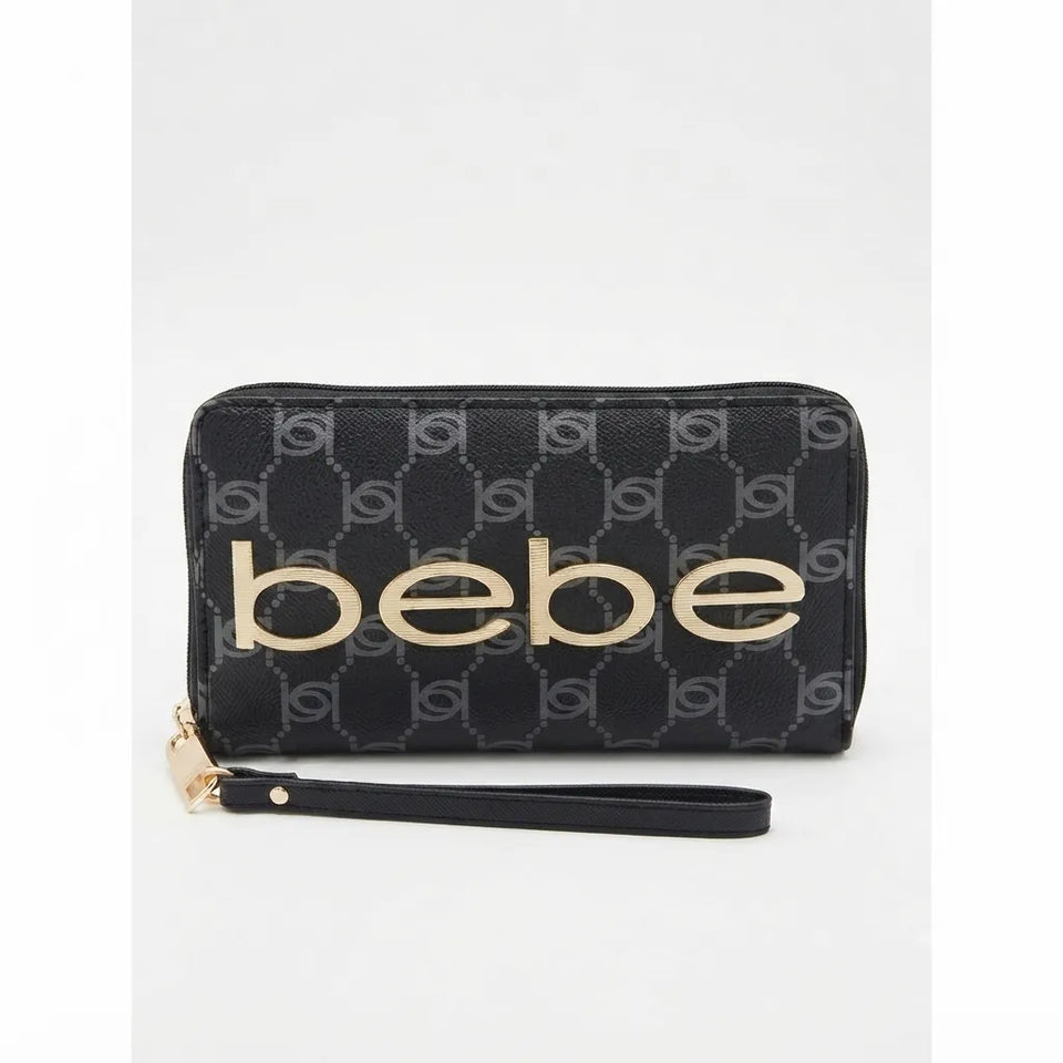A black zip-around wallet with a monogram pattern and a wristlet strap, featuring the name 'bebe' in large gold lettering on the front.